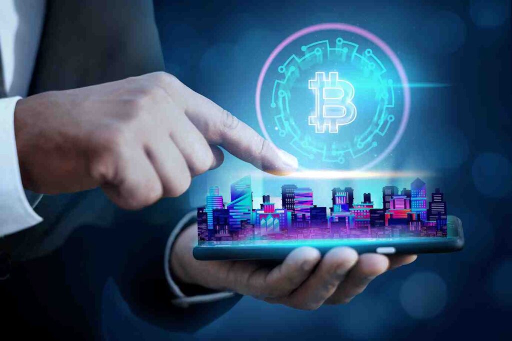 A hand holding a smartphone displays a digital city skyline with a glowing Bitcoin symbol above it, representing cryptocurrency innovation.